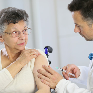 A senior woman getting a vaccine